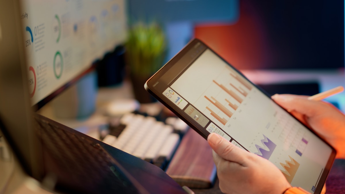 Team reviewing analytics on a tablet